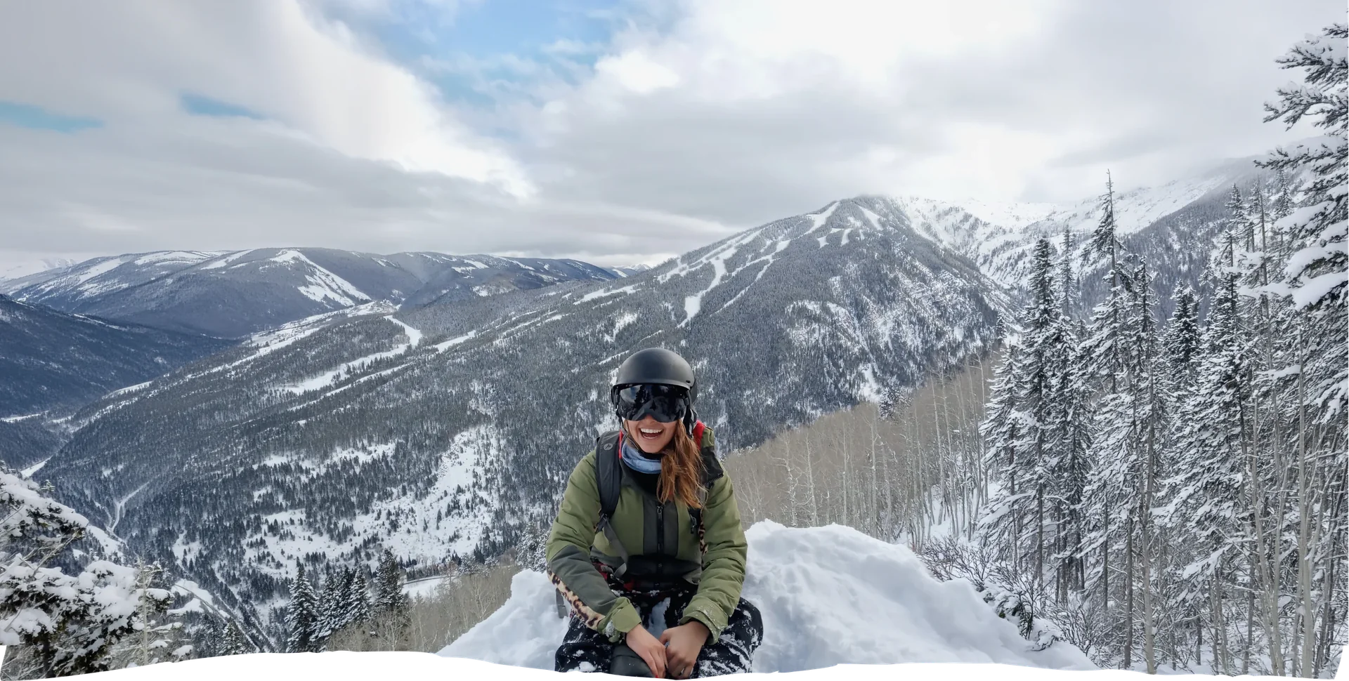 Go Wex participant in front of snowy mountains
